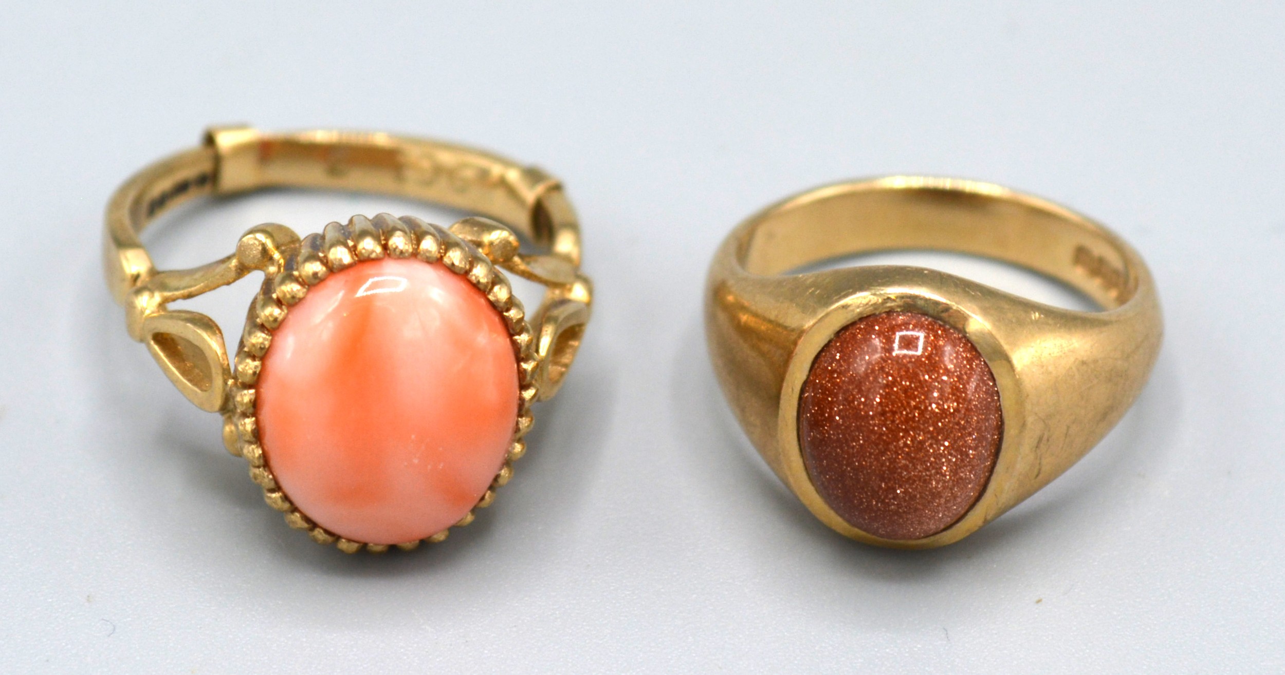 A 9ct. Gold Dress Ring set cabochon coral, ring size K, 4.5 gms. together with another similar