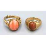 A 9ct. Gold Dress Ring set cabochon coral, ring size K, 4.5 gms. together with another similar