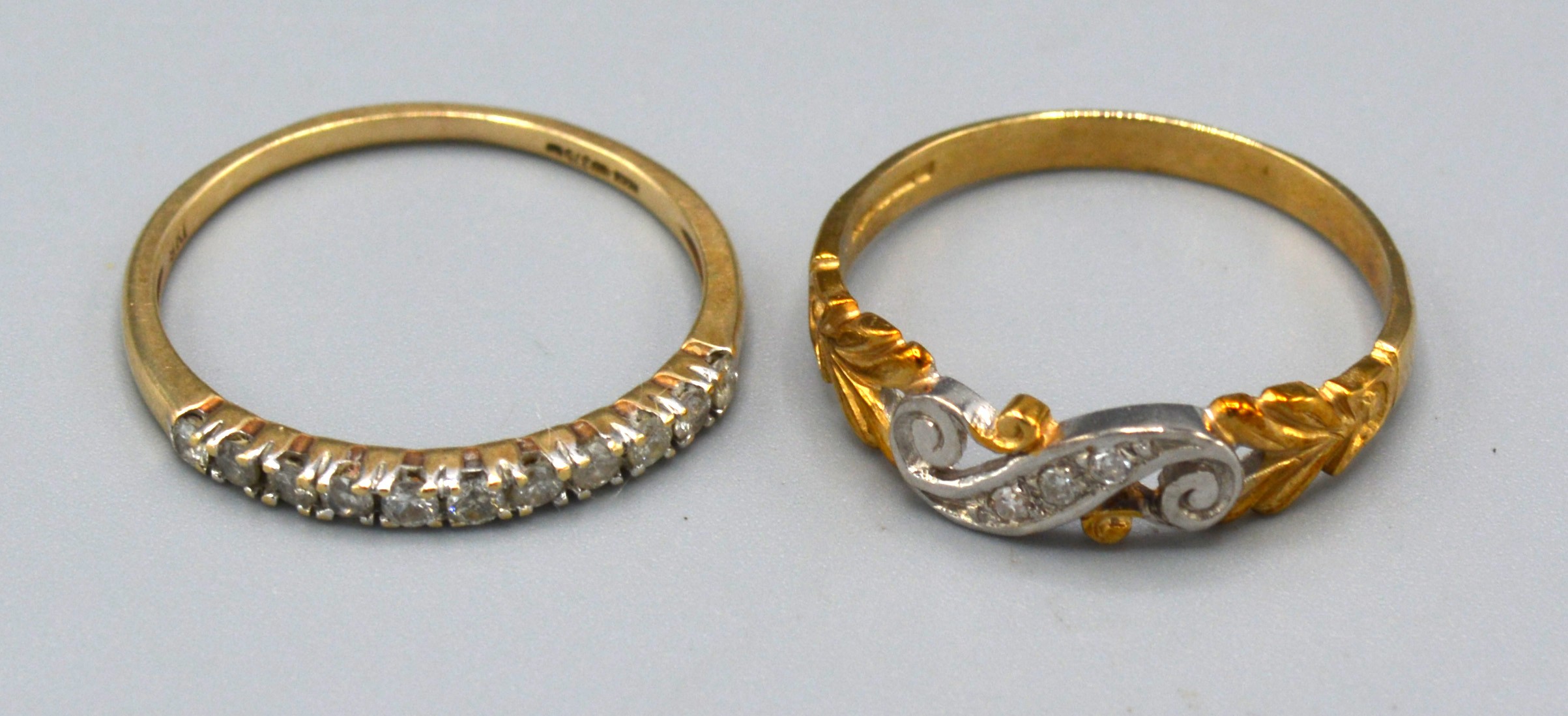 A 9ct. Gold Dress Ring of scroll form set three small diamonds, ring size P, 1.7 gms. together