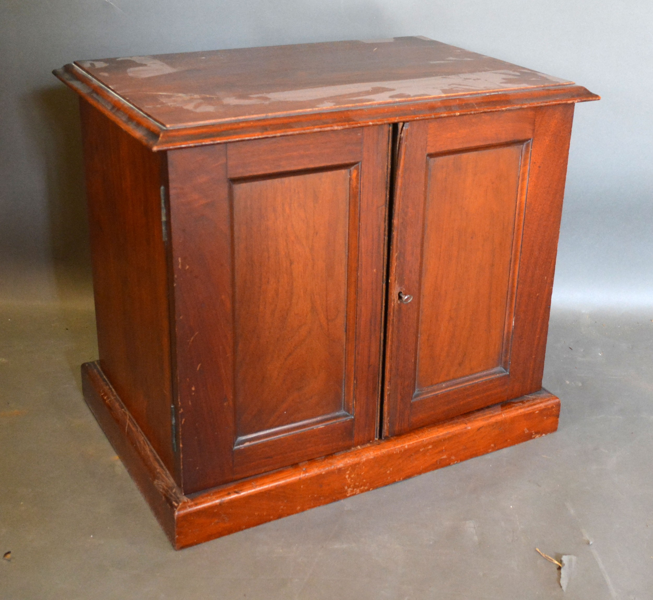 An Edwardian Collectors Cabinet the mould top above two doors enclosing sliding trays raised upon - Image 2 of 2