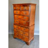 A Walnut Chest on Chest, the moulded cornice above two short and six long graduated drawers, the