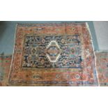 A North West Persian Rug with a central medallion within an all over design upon a blue cream and