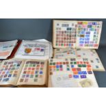 A Strand Stamp Album containing stamps of the world to include Penny Blues and Penny Reds together