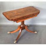 A William IV Rosewood Card Table, the hinged top enclosing a baise lined interior above a scroll