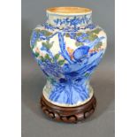 A 19th Century Chinese Porcelain Vase decorated in underglaze blue and iron red depicting an