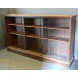 An early 20th century oak large dwarf bookcase, 215cms wide, 38cms deep, 123cms high, together