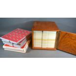 A Coin Collectors Cabinet, table top, together with six coin collectors trays