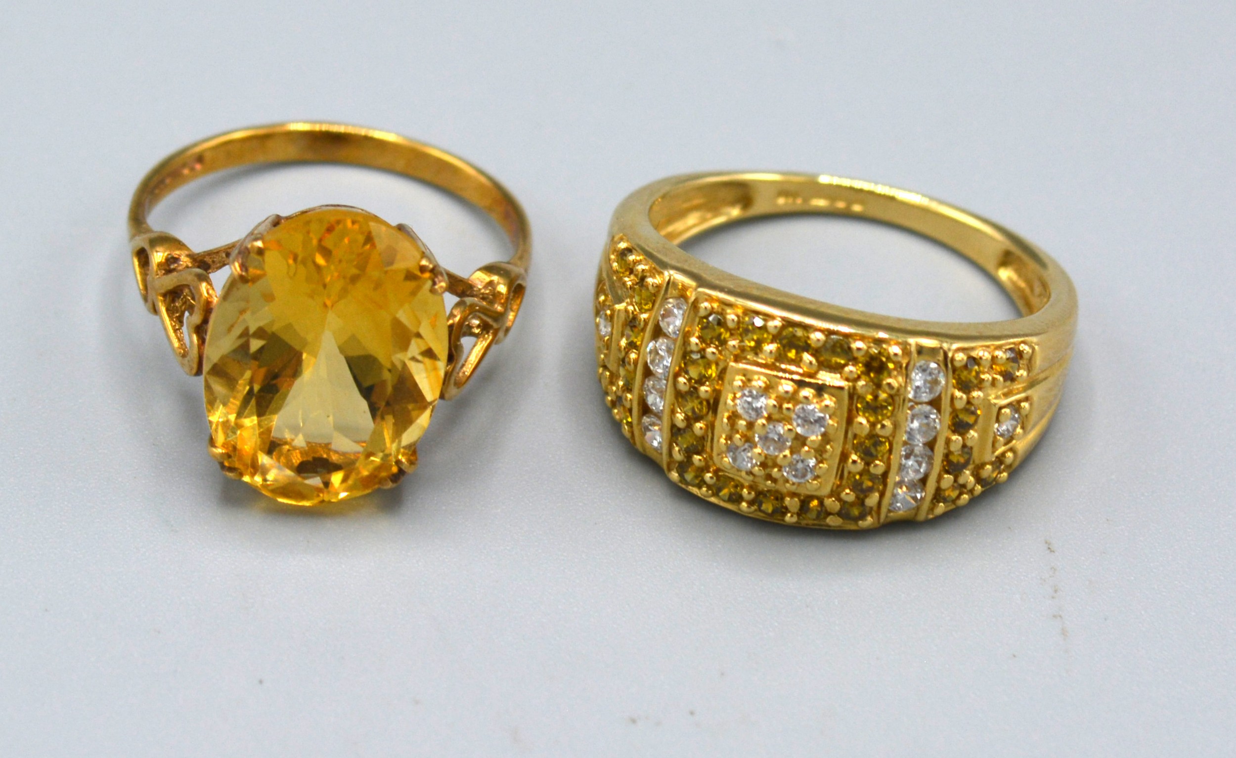 A 9ct. Gold Ring set with an oval citrine, claw set, ring size K, 2.4 gms. together with another