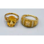 A 9ct. Gold Ring set with an oval citrine, claw set, ring size K, 2.4 gms. together with another