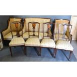 An Edwardian Mahogany Marquetry Inlaid Drawing Room Suite comprising a two seater sofa, a pair of