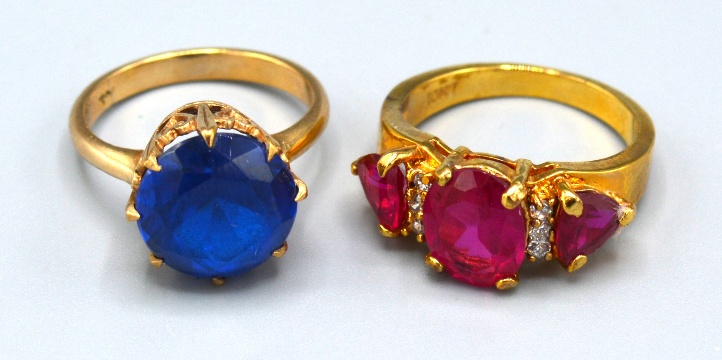 A 10ct. Gold Dress Ring set three red stones, ring size O, 4.6 gms. together with a 9ct. gold