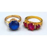 A 10ct. Gold Dress Ring set three red stones, ring size O, 4.6 gms. together with a 9ct. gold