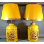 A Pair of Tole Ware Table Lamps in the form of canisters with armorial decoration and Tole Ware