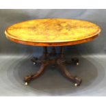 A Victorian burr walnut and marquetry inlaid centre table, the moulded top above a quadruple