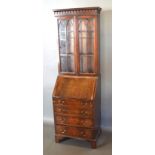 A 20th Century Mahogany Bureau Bookcase, the moulded cornice above two astragal glazed doors, the
