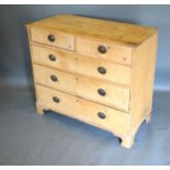 A 19th Century pine chest, the moulded top above two short and three long drawers with oval brass