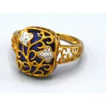 A 9ct. Gold Ring set with small diamonds and lapis lazuli within a scroll setting, ring size O, 3.