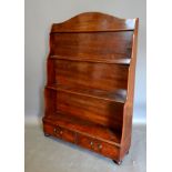 A Late 19th Century Mahogany Waterfall Bookcase with three graduated shelves above two drawers