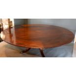 In the style of Jupe A 20th Century Mahogany Circular Dining Table with removable outer sections
