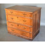 An Early Oak Chest with four graduated drawers and brass handles raised upon a plinth, 91 cms