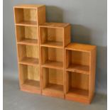 In the style of Heals A Group of Three Graduated Oak Bookcases