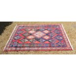 A North West Persian rug with a central medallion within an all over design within multiple borders,