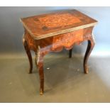 A French inlaid and gilt metal mounted card table, the hinged top above a shaped inlaid frieze,