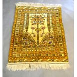 A North West Persian Woollen Prayer Rug with an all-over design upon a cream ground within