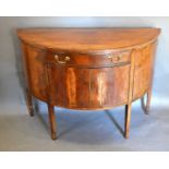 A 19th Century Mahogany Demi-Lune Side Cabinet with a central drawer and two cupboard doors
