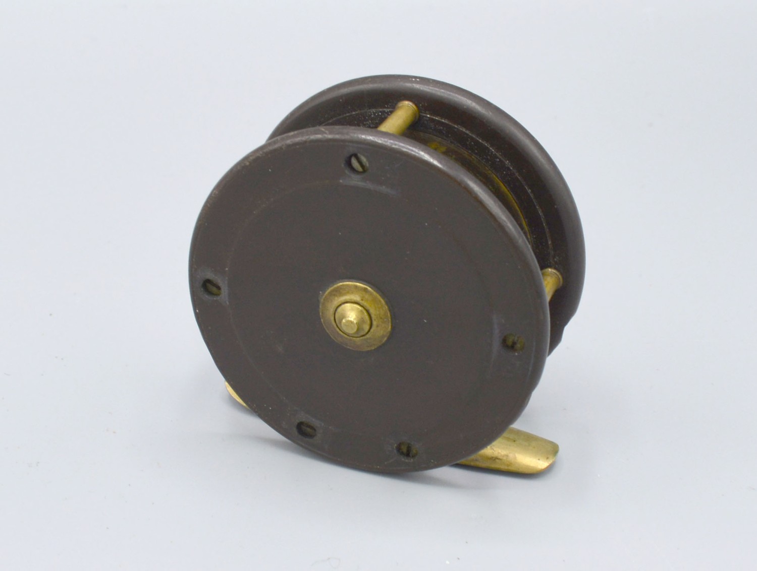 Eaton and Deller a brass mounted fishing reel, 6.5cms diameter - Image 2 of 2