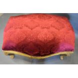 A Large French Style Gilded Stool of shaped form, the burgundy upholstered seat above a carved