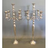 A pair of five branch candelabrum with circular pedestal bases, 91.5cms tall