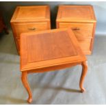 A Pair of Chinese Hardwood Bedside Chests each with two drawers with brass handles together with a