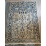 A North West Persian Woollen Rug with an all over design upon a blue and cream ground within