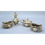 A Victorian Silver Four Piece Condiment Set comprising a pair of salts, mustard and a pepper