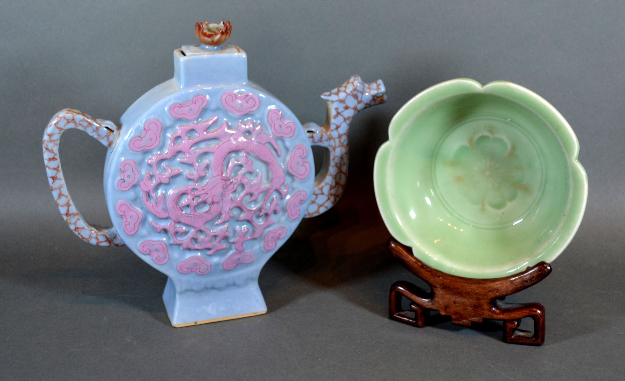 A Chinese Celadon Bowl of shaped outline with hardwood stand 14 cms diameter together with a Chinese