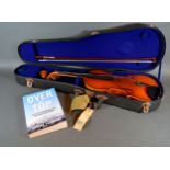 A Violin by the Kiso Suzuki Violin Company Ltd. with ebony fret board within fitted case belonging