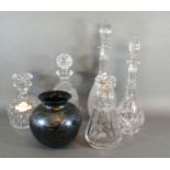 A Baccarat Glass Decanter with stopper together with four other similar decanters and an Isle of