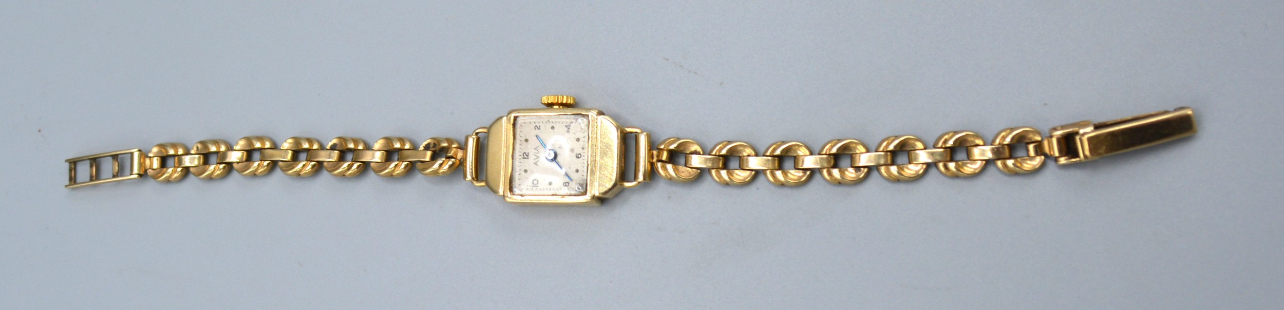 A 9ct. Gold Cased Ladies Wrist Watch by Avia with 9ct. gold bracelet, 13.5 gms excluding movement