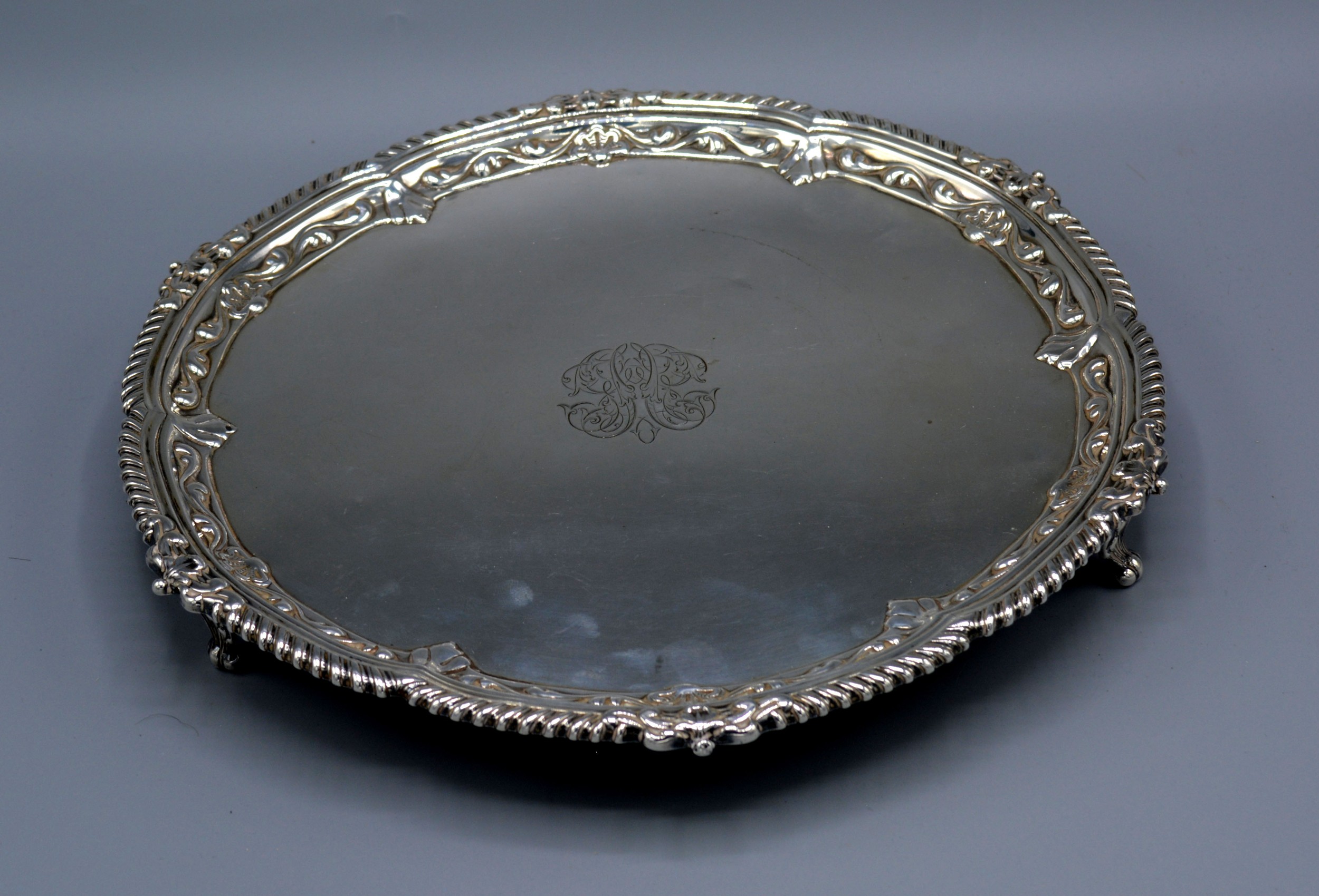 A Victorian Silver Salver of shaped outline with three scroll feet London 1882, 16 ozs. 26 cms
