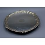 A Victorian Silver Salver of shaped outline with three scroll feet London 1882, 16 ozs. 26 cms