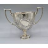 A Victorian Silver Large Two Handled Trophy Cup of embossed scroll form London 1891, makers Mappin