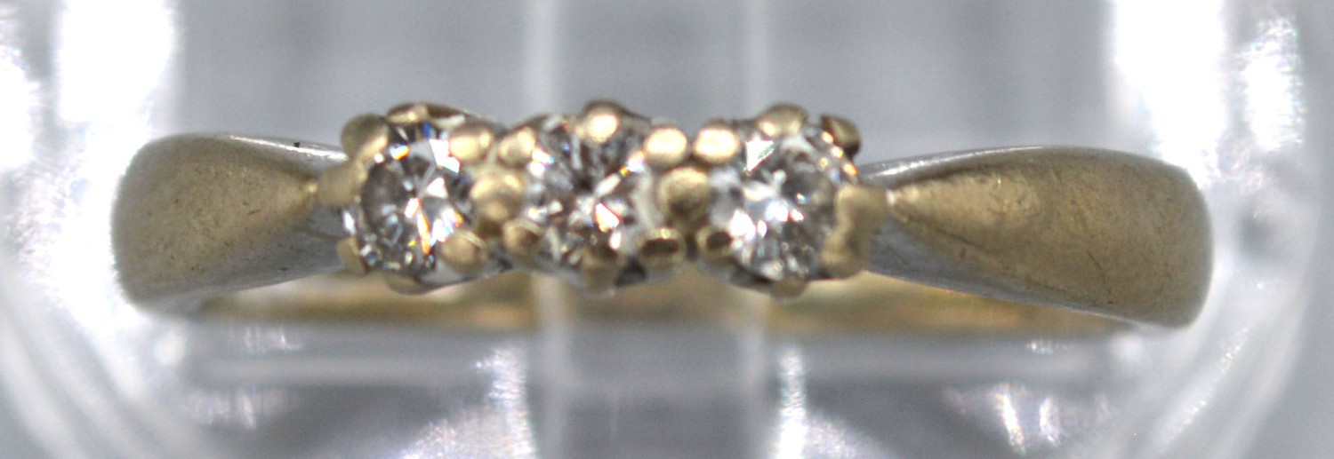 An 18ct White Gold Three Stone Diamond Ring with pierced setting, 3.2 gms Size L - Image 2 of 2