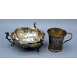 An Edwardian Silver Bowl with three shaped supports Chester 1903 together with a London silver mug