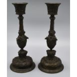 A Pair of Patinated Bronze Candlesticks 21 cms tall