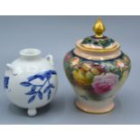 A Royal Worcester Bulbous Shaped Squat Vase decorated in blue and white in the Oriental style