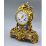 A 19th Century French Ormolu Mantle Clock, the enamel dial with Roman and Arabic numerals and