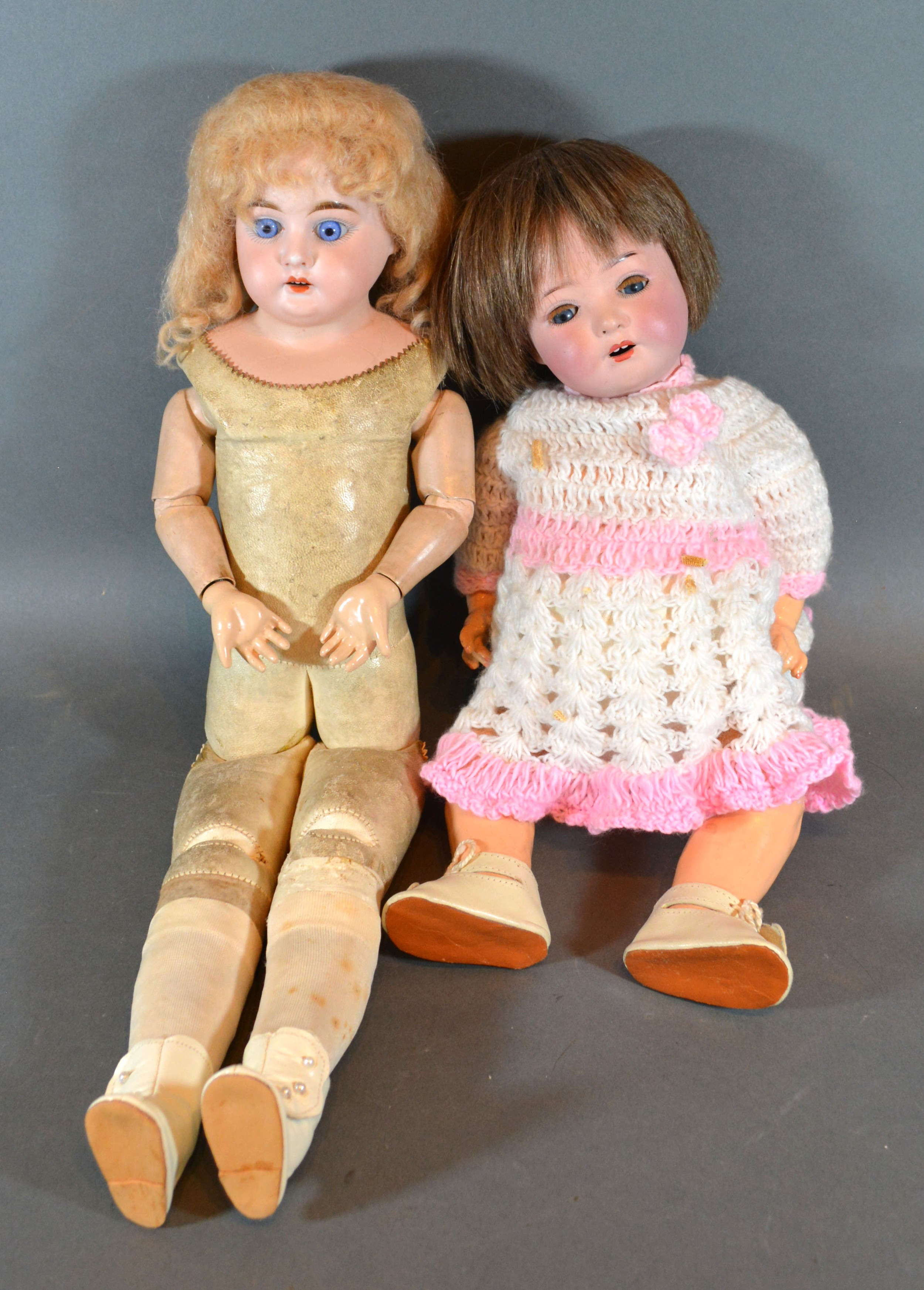 An Armand Marseille Bisque Head Doll No. 3200 with leather jointed body together with another bisque