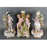 A Pair of German Porcelain Figures decorated in polychrome enamels and highlighted with gilt 26
