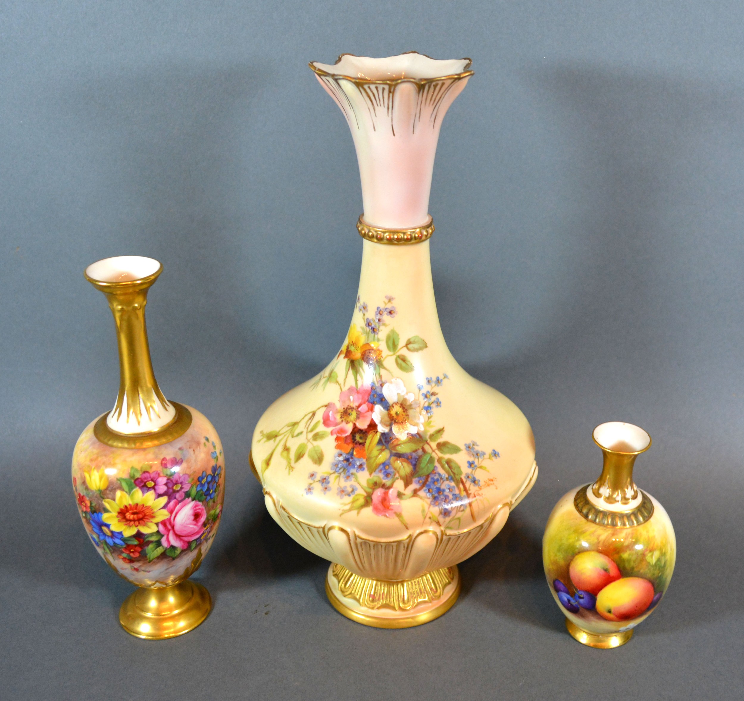 A Royal Worcester Porcelain Vase hand painted by Ernest Barker 18.5 cms tall together with another